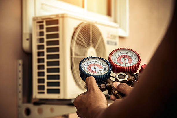 Professional Air Conditioning Service technician working in Arlington, IN